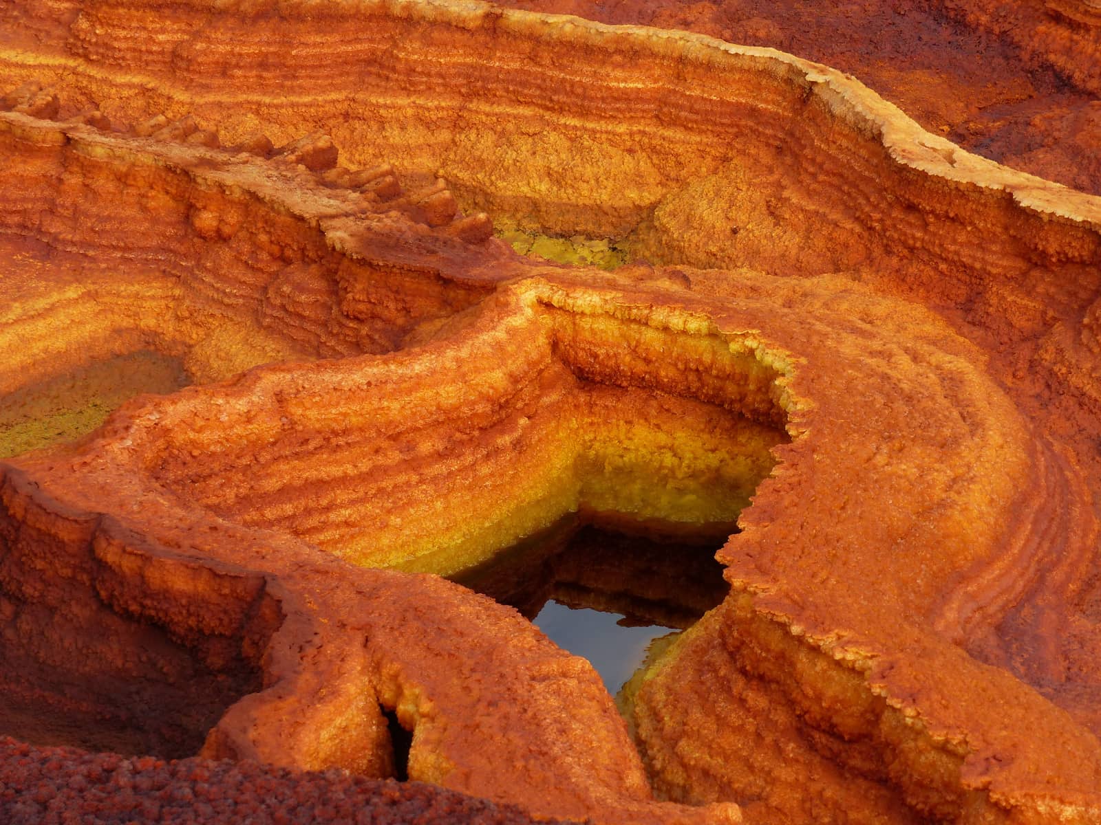 Orange mineral terraces at Dallol in the Danakil Depression